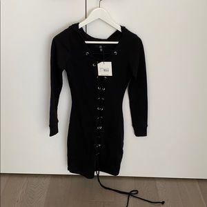 Dress with hood and laced front.